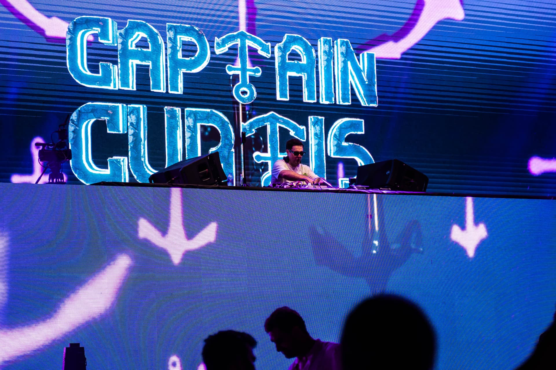 Blue neon Captain Curtis stage design during a club show